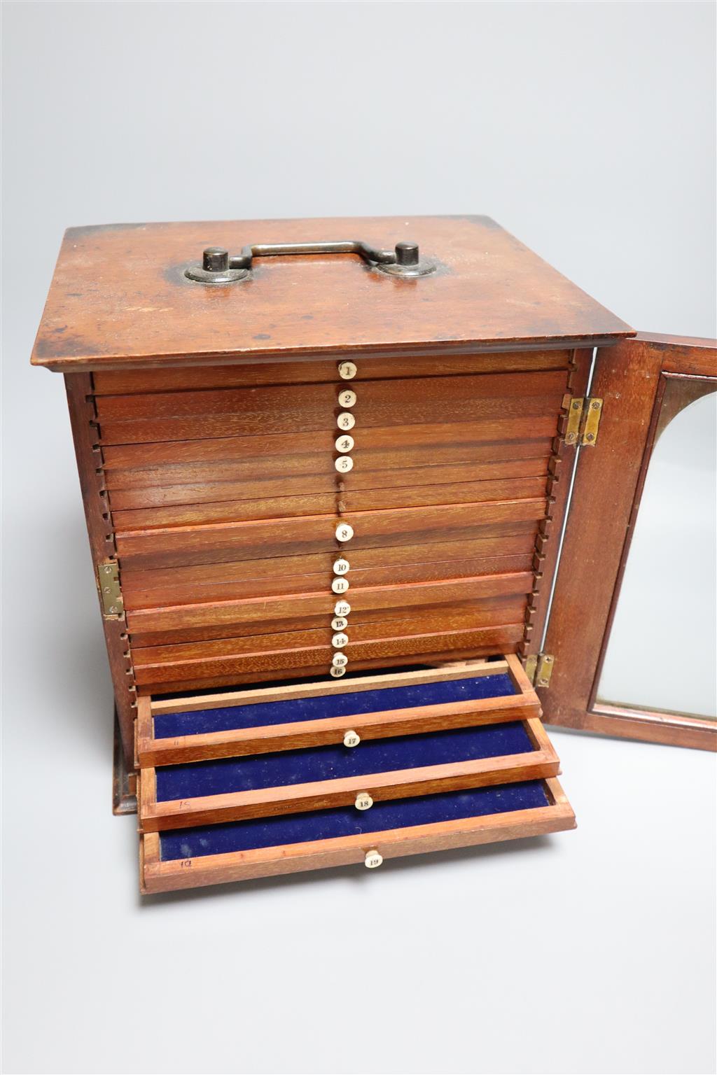 A Victorian mahogany coin collectors cabinet, 27cm wide, and a mahogany table top bank of four drawers